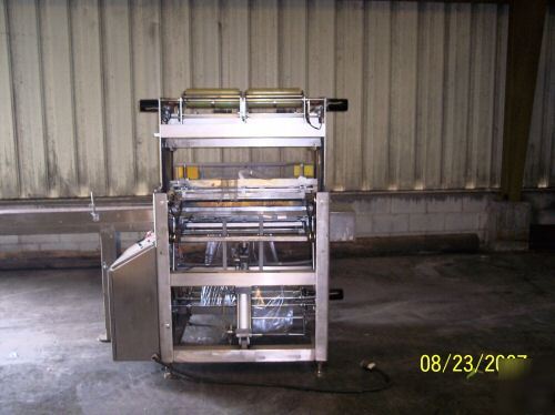 Omega dl-27 overwrap machine/bundler and heat tunnel