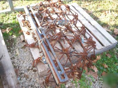 Drag harrow, flexible tines, pull type