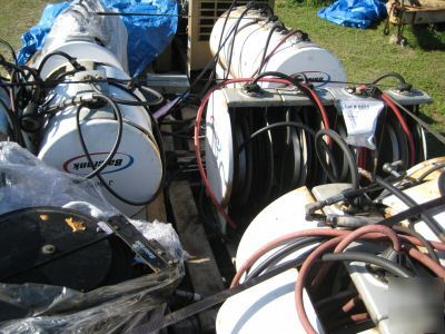 Whole lot of hose reels , used on oil-air-grease.